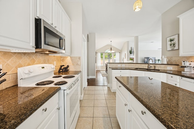 1532 Streams Way, Allen, TX 75002 - kitchen featuring white appliances, a sink, white cabinetry, lofted ceiling, and decorative backsplash