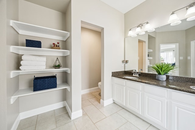 1532 Streams Way, Allen, TX 75002 - full bathroom featuring double vanity, toilet, baseboards, and tile patterned floors