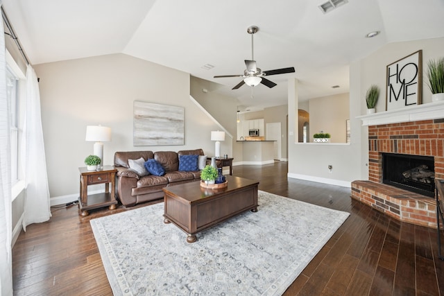 1532 Streams Way, Allen, TX 75002 - living room featuring a ceiling fan, dark wood-style flooring, lofted ceiling, baseboards, and a brick fireplace
