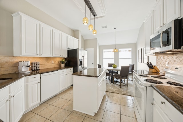 1532 Streams Way, Allen, TX 75002 - kitchen with appliances with stainless steel finishes, backsplash, white cabinets, a center island, and decorative light fixtures