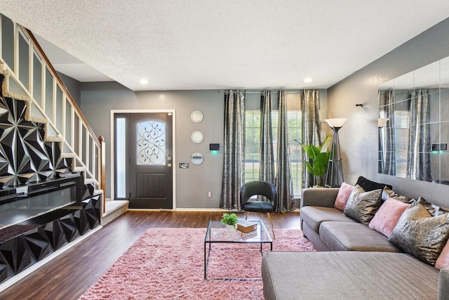3017 Deanne Ct, Fort Worth, TX 76123 - living room featuring stairway, wood finished floors, baseboards, recessed lighting, and a textured ceiling