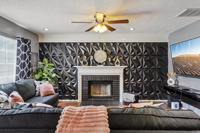 3017 Deanne Ct, Fort Worth, TX 76123 - living area with a ceiling fan, a textured ceiling, a fireplace, and recessed lighting