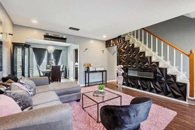 3017 Deanne Ct, Fort Worth, TX 76123 - living room featuring a chandelier, wood finished floors, stairs, recessed lighting, and baseboards
