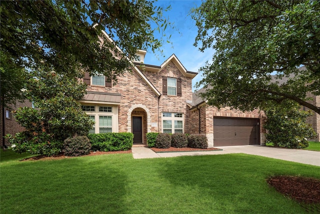 8670 Soto Ln, Frisco, TX 75036 - view of front of home featuring brick siding, concrete driveway, a front lawn, and a garage