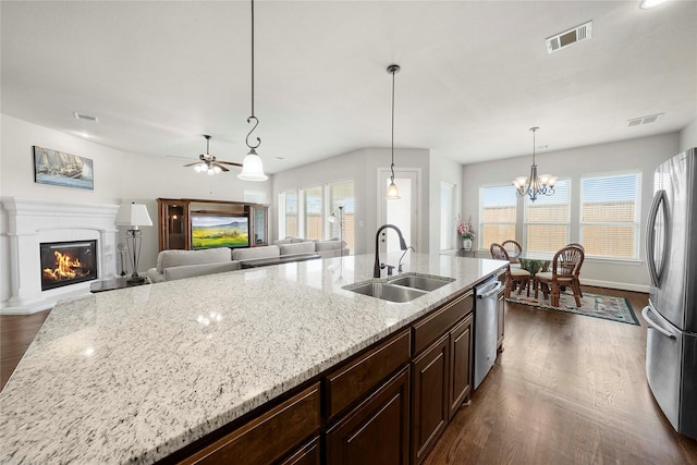 8670 Soto Ln, Frisco, TX 75036 - kitchen featuring a sink, appliances with stainless steel finishes, dark wood finished floors, and healthy amount of natural light