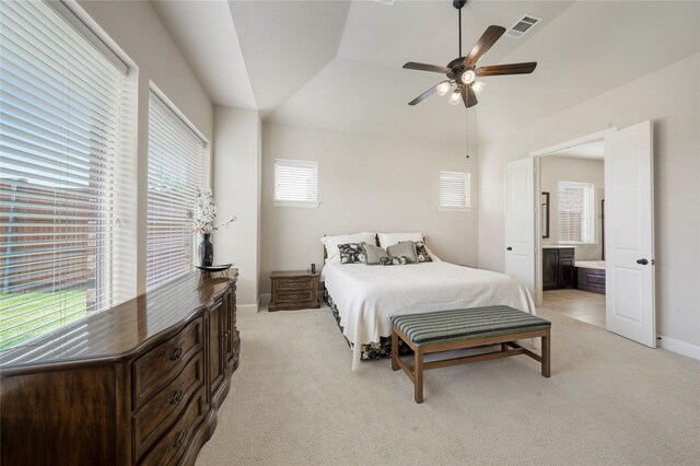 8670 Soto Ln, Frisco, TX 75036 - bedroom featuring light carpet, ensuite bath, baseboards, vaulted ceiling, and ceiling fan