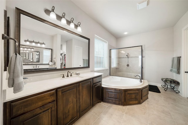 8670 Soto Ln, Frisco, TX 75036 - bathroom featuring tiled shower, a bath, vanity, tile patterned flooring, and baseboards
