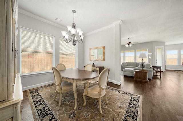 8670 Soto Ln, Frisco, TX 75036 - dining room with baseboards, a chandelier, dark wood finished floors, crown molding, and a ceiling fan