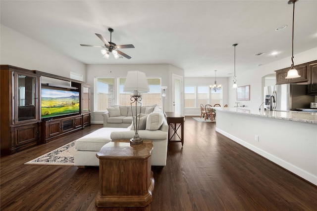 8670 Soto Ln, Frisco, TX 75036 - living room with ceiling fan, dark wood-style flooring, baseboards, plenty of natural light, and recessed lighting