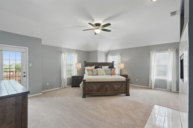 3752 Menard Dr, Carrollton, TX 75010 - bedroom with light carpet, access to outside, multiple windows, baseboards, and lofted ceiling