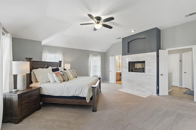 3752 Menard Dr, Carrollton, TX 75010 - bedroom with light carpet, a multi sided fireplace, lofted ceiling, connected bathroom, and a ceiling fan