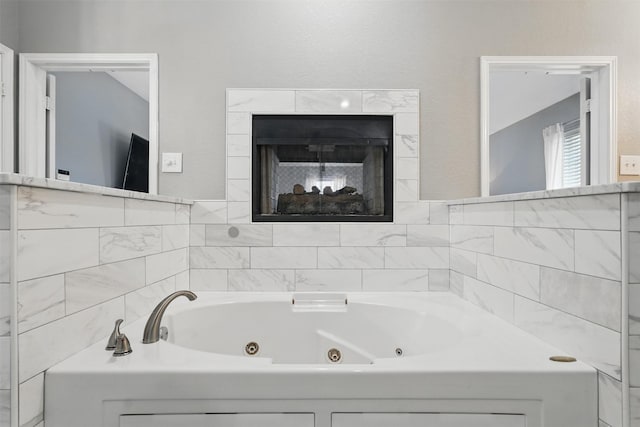 3752 Menard Dr, Carrollton, TX 75010 - full bathroom with a whirlpool tub and a multi sided fireplace