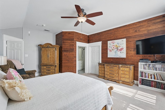 3752 Menard Dr, Carrollton, TX 75010 - bedroom with wood walls, light carpet, a ceiling fan, and vaulted ceiling