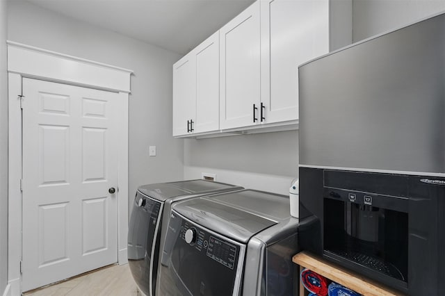 3752 Menard Dr, Carrollton, TX 75010 - laundry area featuring washing machine and dryer and cabinet space