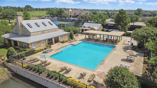 3752 Menard Dr, Carrollton, TX 75010 - community pool featuring a patio area