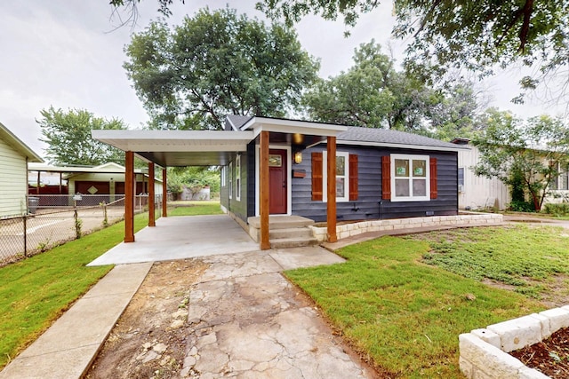 2217 36th St, Fort Worth, TX 76106 - view of front of house with asphalt driveway and a carport