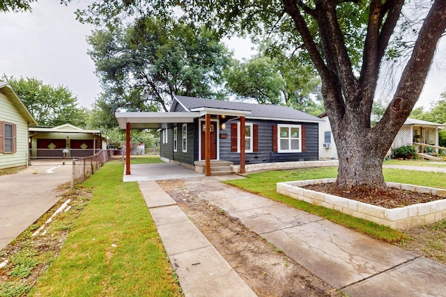 2217 36th St, Fort Worth, TX 76106 - view of front facade with concrete driveway and an attached carport