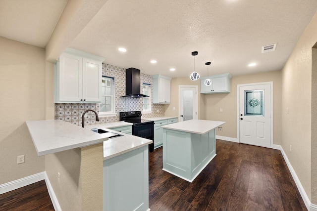 2217 36th St, Fort Worth, TX 76106 - kitchen featuring wall chimney range hood, black electric range oven, a sink, backsplash, and a peninsula