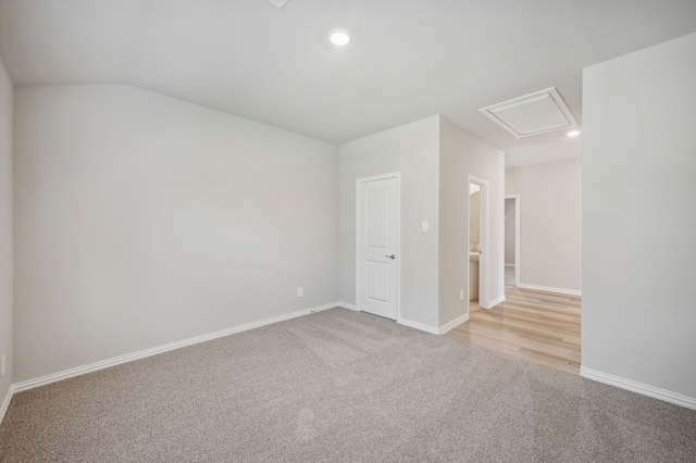 301 Sierra Rdg, Lavon, TX 75166 - spare room with attic access, light colored carpet, recessed lighting, baseboards, and lofted ceiling