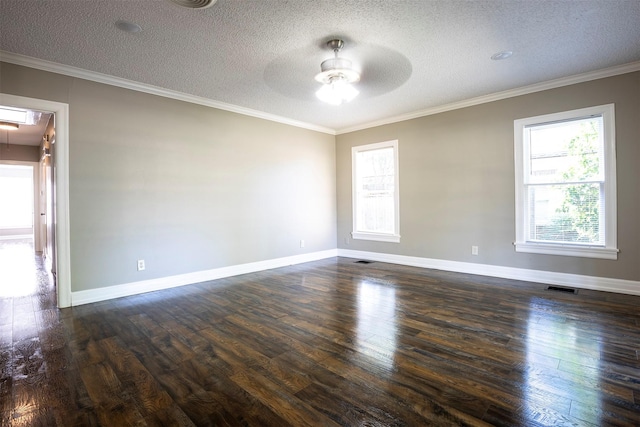 1109 Sayles Blvd, Abilene, TX 79605 - unfurnished room featuring a ceiling fan, dark wood-style flooring, attic access, ornamental molding, and a textured ceiling