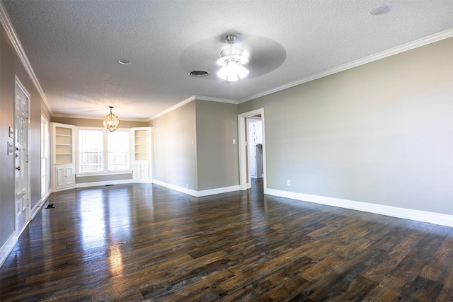 1109 Sayles Blvd, Abilene, TX 79605 - spare room with a textured ceiling, dark wood-type flooring, a chandelier, ceiling fan, and baseboards
