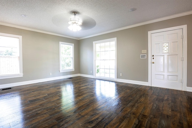 1109 Sayles Blvd, Abilene, TX 79605 - unfurnished room with a ceiling fan, dark wood-style flooring, crown molding, a textured ceiling, and baseboards