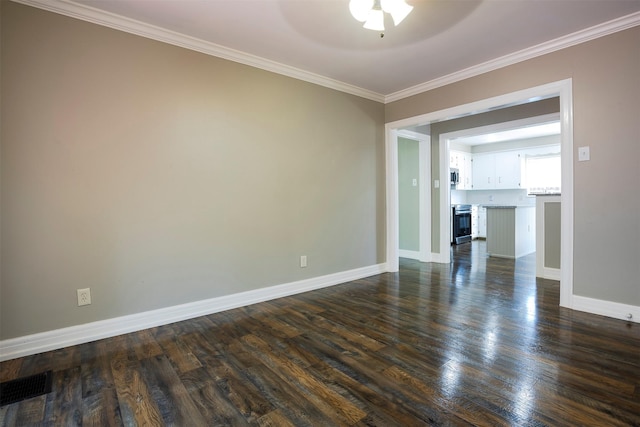 1109 Sayles Blvd, Abilene, TX 79605 - unfurnished room with a ceiling fan, ornamental molding, dark wood-type flooring, and baseboards