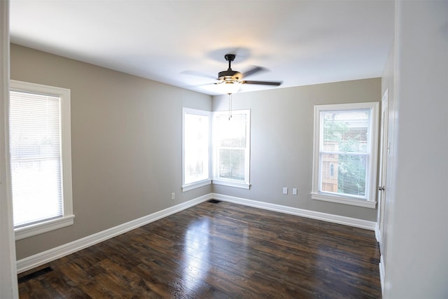 1109 Sayles Blvd, Abilene, TX 79605 - spare room featuring dark wood-type flooring, baseboards, and ceiling fan