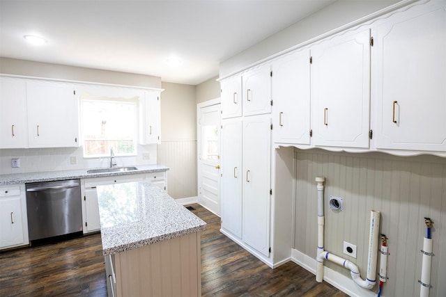 1109 Sayles Blvd, Abilene, TX 79605 - kitchen with dishwasher, a sink, dark wood finished floors, white cabinets, and light stone countertops