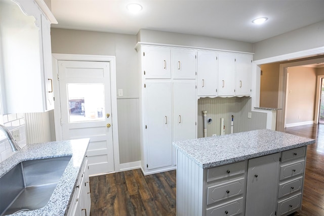 1109 Sayles Blvd, Abilene, TX 79605 - kitchen featuring a sink, dark wood-type flooring, white cabinets, light stone counters, and recessed lighting