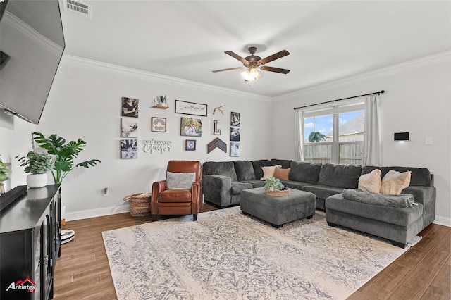 608 Ives Way, Haughton, LA 71037 - living room with ornamental molding, wood finished floors, ceiling fan, and baseboards