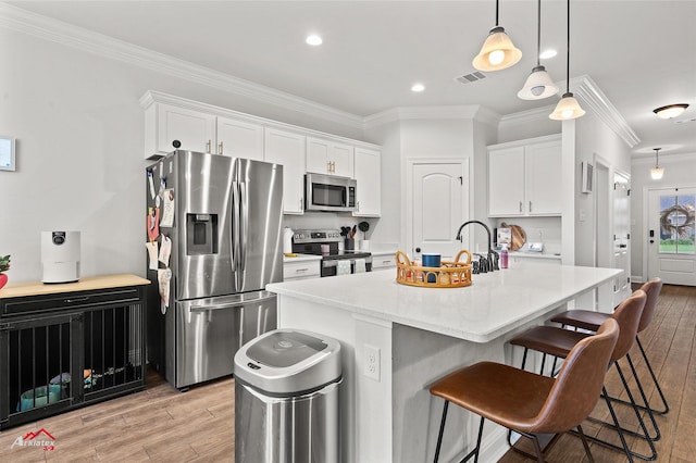 608 Ives Way, Haughton, LA 71037 - kitchen with stainless steel appliances, light wood finished floors, crown molding, a kitchen breakfast bar, and white cabinetry