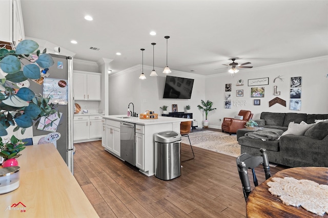 608 Ives Way, Haughton, LA 71037 - kitchen with stainless steel dishwasher, open floor plan, a sink, light countertops, and ornamental molding