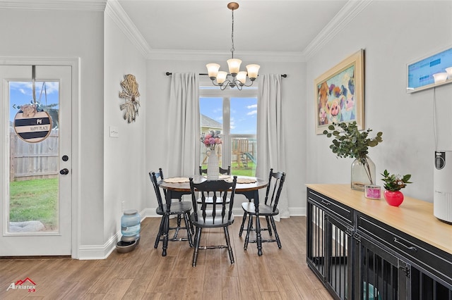 608 Ives Way, Haughton, LA 71037 - dining area with a chandelier, light wood finished floors, crown molding, and baseboards