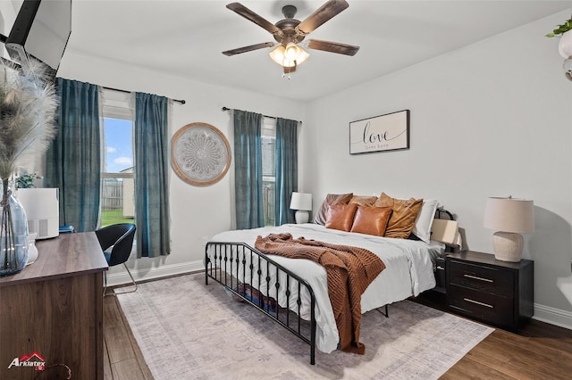 608 Ives Way, Haughton, LA 71037 - bedroom with baseboards, wood finished floors, ceiling fan, and an office area