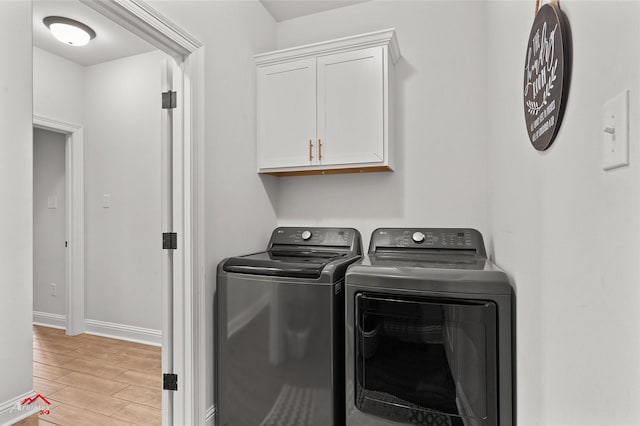 608 Ives Way, Haughton, LA 71037 - washroom with washer and dryer, cabinet space, light wood-style floors, and baseboards