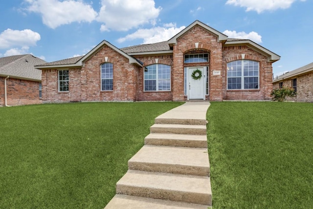 3137 Bent Oak Dr, Mesquite, TX 75181 - view of front of property with brick siding, a front lawn, and roof with shingles