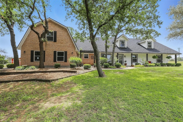9816 County Road 603c, Burleson, TX 76028 - view of front of house with a front lawn, board and batten siding, and brick siding