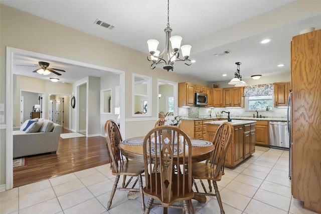 9816 County Road 603c, Burleson, TX 76028 - dining area featuring a chandelier, light tile patterned flooring, recessed lighting, baseboards, and ceiling fan