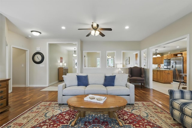 9816 County Road 603c, Burleson, TX 76028 - living room with light wood-style flooring, a ceiling fan, baseboards, and recessed lighting