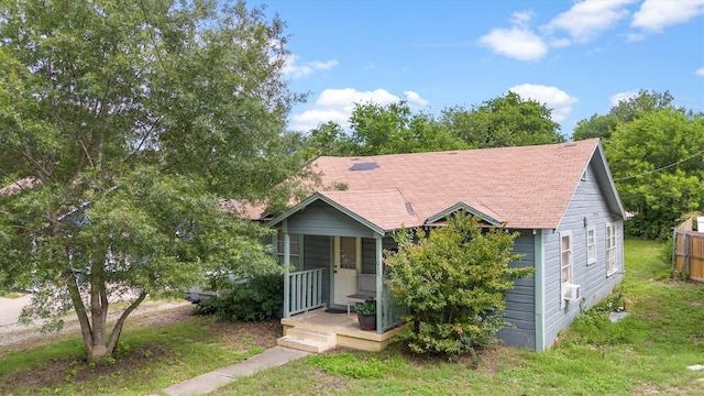1010 Cole St, Mckinney, TX 75069 - view of front of home featuring roof with shingles, a porch, and a front yard