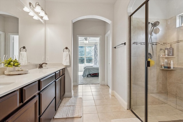 1029 Spring Falls Dr, Mckinney, TX 75071 - ensuite bathroom featuring double vanity, a stall shower, tile patterned flooring, and ceiling fan