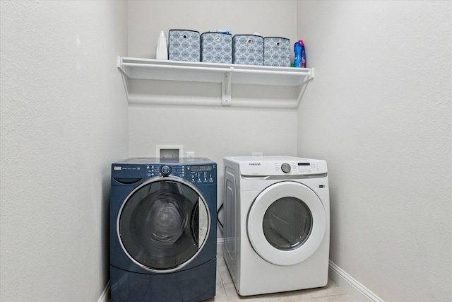 1029 Spring Falls Dr, Mckinney, TX 75071 - washroom featuring washer and dryer, light tile patterned floors, and baseboards