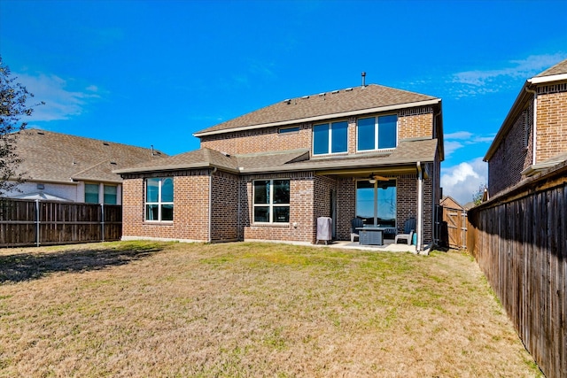 1029 Spring Falls Dr, Mckinney, TX 75071 - back of property featuring brick siding, roof with shingles, and a patio