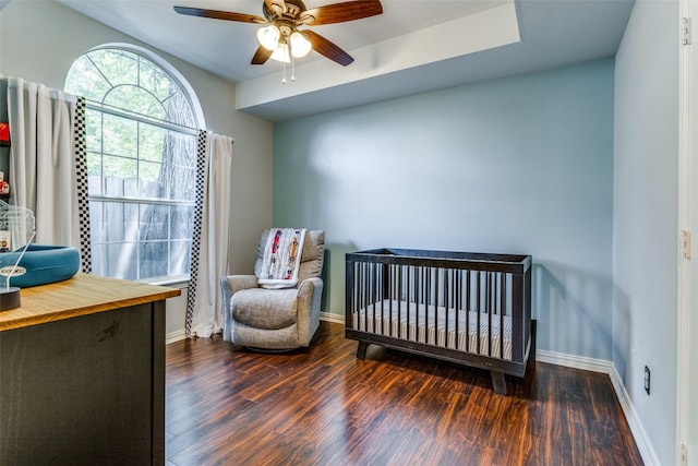 1611 N College St, Mckinney, TX 75069 - bedroom with wood finished floors, a nursery area, baseboards, and ceiling fan