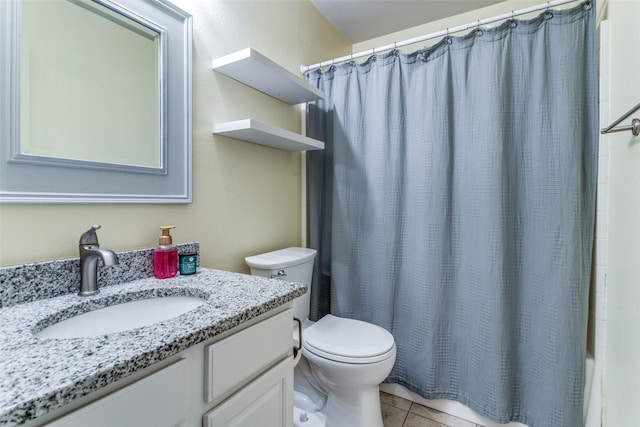 1611 N College St, Mckinney, TX 75069 - bathroom featuring toilet, vanity, tile patterned floors, and shower / bath combo with shower curtain