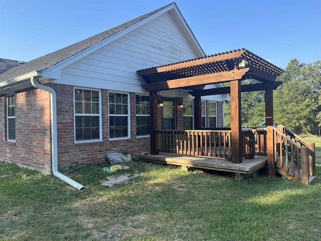 322 Farm Rd Unit 2283, Clarksville, TX 75426 - back of property with a wooden deck, a lawn, brick siding, and roof with shingles
