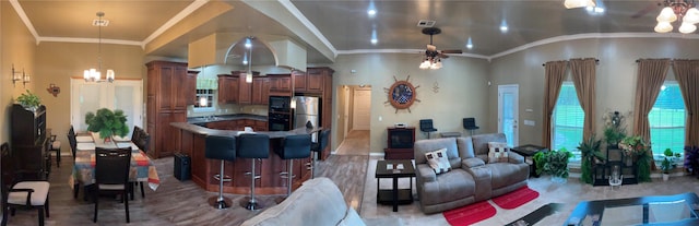 322 Farm Rd Unit 2283, Clarksville, TX 75426 - living room with a chandelier, crown molding, a ceiling fan, and vaulted ceiling