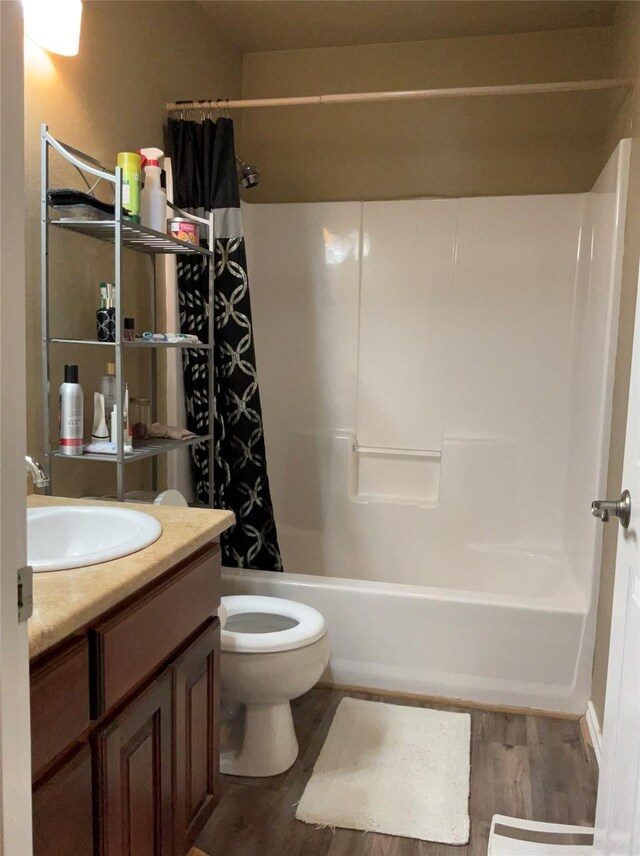 322 Farm Rd Unit 2283, Clarksville, TX 75426 - bathroom featuring wood finished floors, vanity, shower / bath combo, and toilet