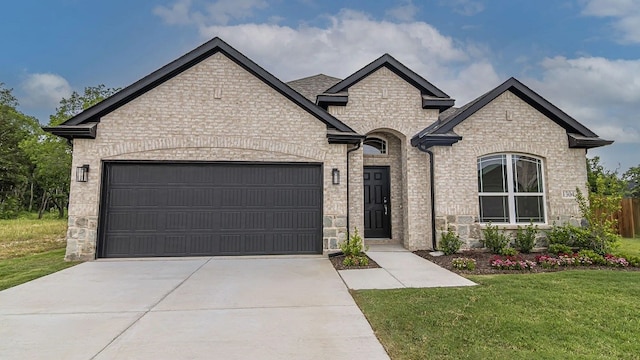 1304 Cole Dr, Trenton, TX 75490 - french country home with stone siding, driveway, and a garage